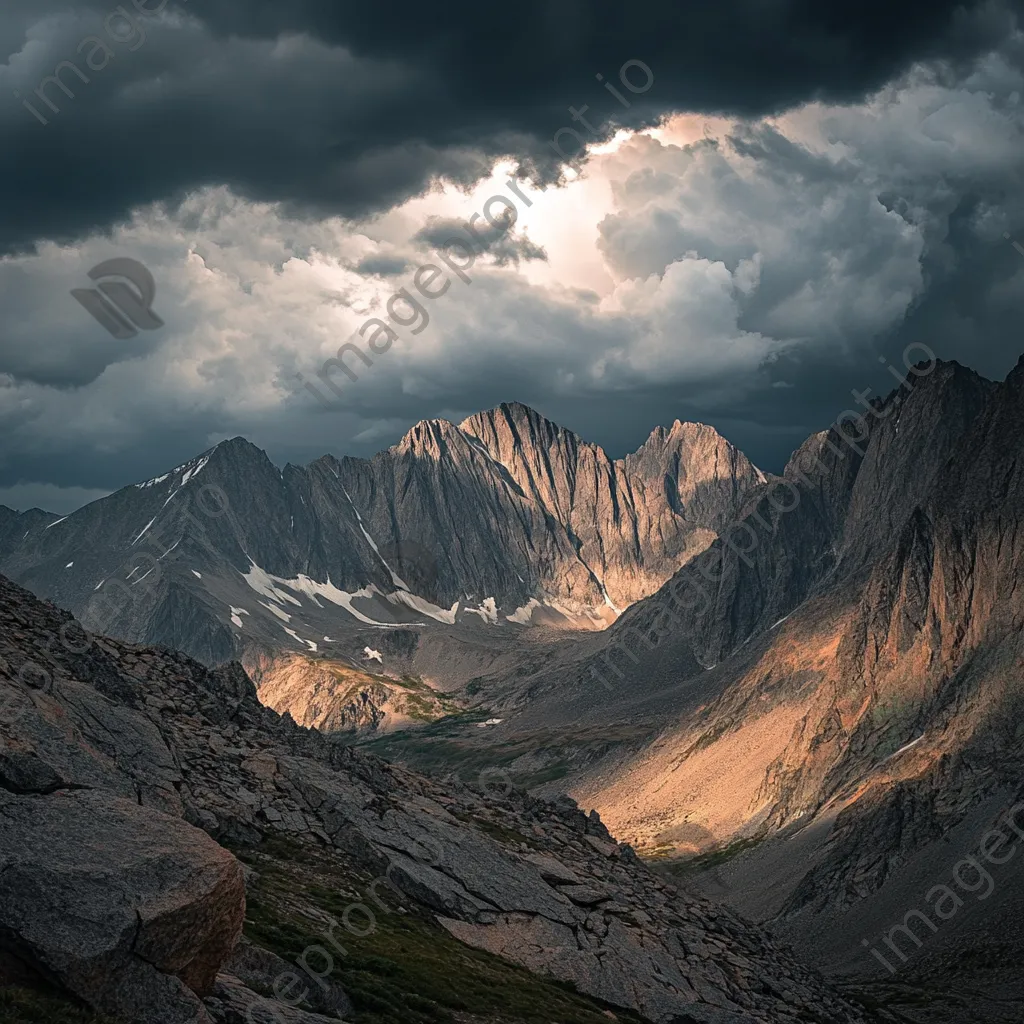 Rocky mountain ridges beneath dark storm clouds - Image 1