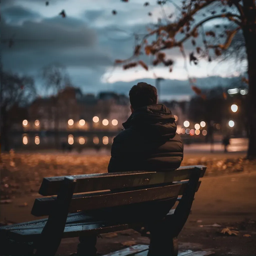 Person alone on bench looking distressed for mental health awareness - Image 2