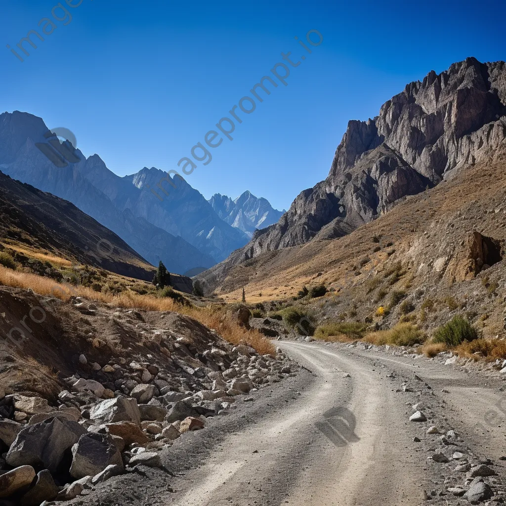 High-altitude mountain pass with gravel road and rock formations - Image 4