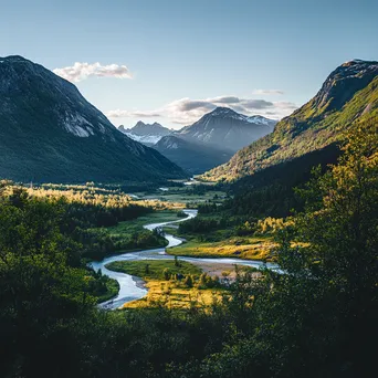 Mountain valley with a winding river and dramatic peaks - Image 4