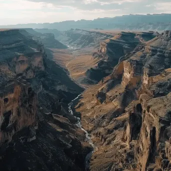 Canyon aerial view with helicopters exploring, rugged terrain scene - Image 2