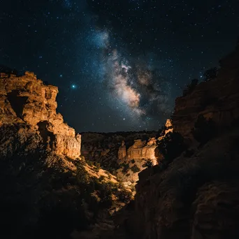 Canyon view at night under the Milky Way - Image 1