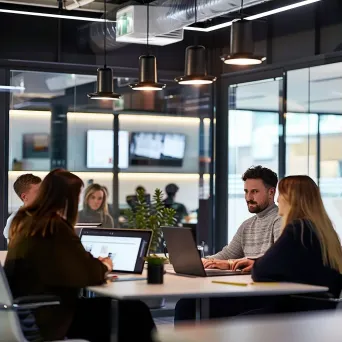 Diverse team collaborating in modern office space - Image 3