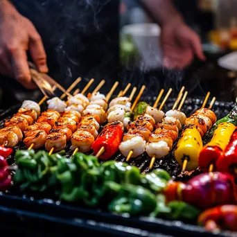 Chef grilling shrimp skewers with vegetables on a barbecue - Image 4