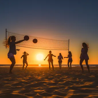 Friends playing beach volleyball at sunset - Image 1