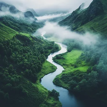 Winding river in a misty valley with greenery - Image 4