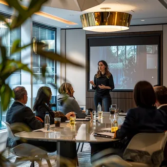 Female executive presenting in a modern boardroom - Image 3