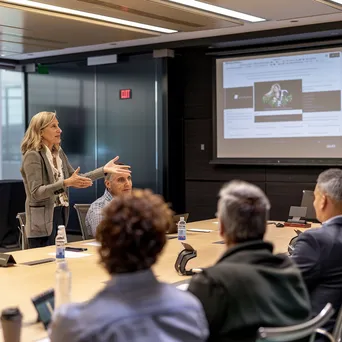 Female executive presenting in a modern boardroom - Image 4