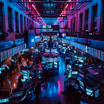 Traders engaged on a busy stock trading floor with screens - Image 1