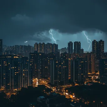 Thunderstorm with rain and lightning over a city skyline. - Image 4