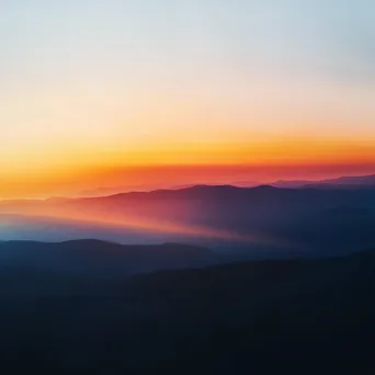 Blurred mountain range at sunset - Image 4