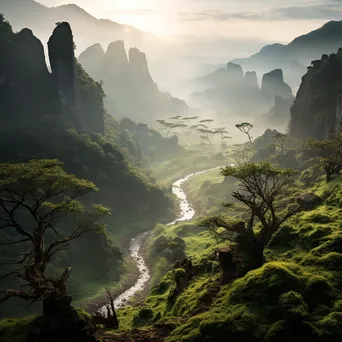 Misty mountain valley with winding path and ancient trees - Image 1