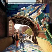 Pedestrian bridge adorned with a vibrant, community-created mosaic tile artwork - Image 1