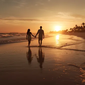 Couple Walking on the Beach at Sunset