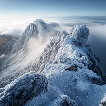 Rocky mountain ridge covered in frost and mist - Image 1