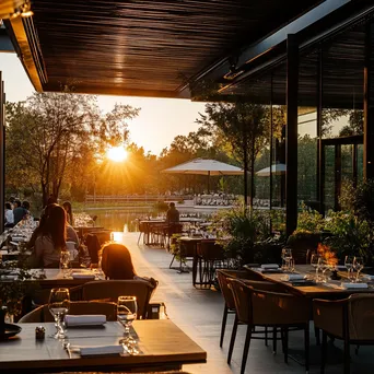 Upscale outdoor dining with guests and sunset lighting - Image 1