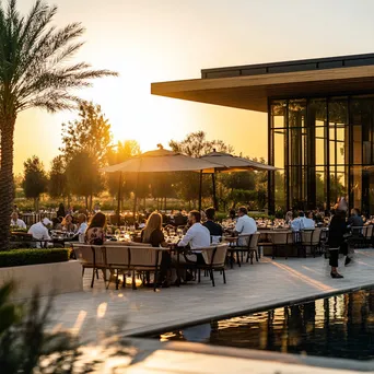 Upscale outdoor dining with guests and sunset lighting - Image 4