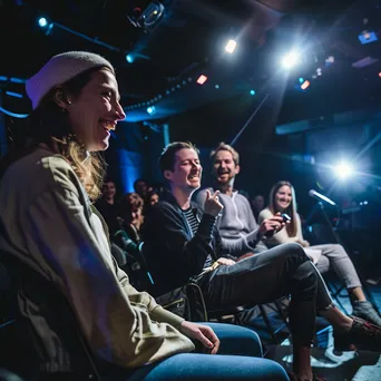 Panelists laughing during an engaging panel discussion on stage - Image 2