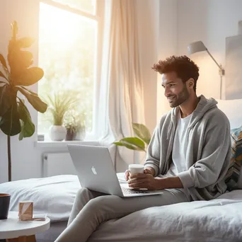 Young adult using laptop to explore health services - Image 1