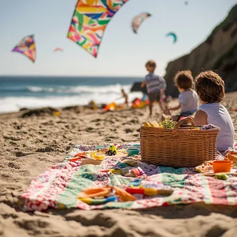 Family picnic with a colorful blanket and kids flying kites on the beach. - Image 1