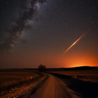 Fiery comet streaking through a starry sky with a bright trail - Image 1