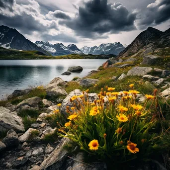 Alpine lake bordered by rocky cliffs and wildflowers in spring - Image 1