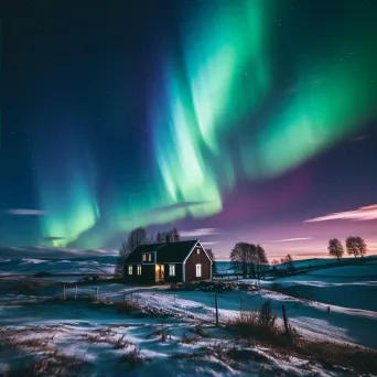 Northern lights over countryside hills - Image 2