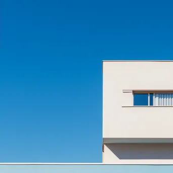 Minimalist building facade against blue sky shot on Sony A7 III - Image 2