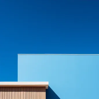 Minimalist building facade against blue sky shot on Sony A7 III - Image 4