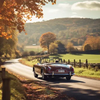 Classic convertible car in a scenic countryside with autumn leaves - Image 3