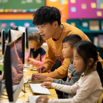 Older student guiding kids in a coding workshop. - Image 3