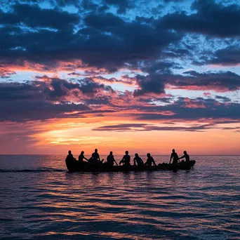 Silhouetted pearl divers against sunset sky - Image 4