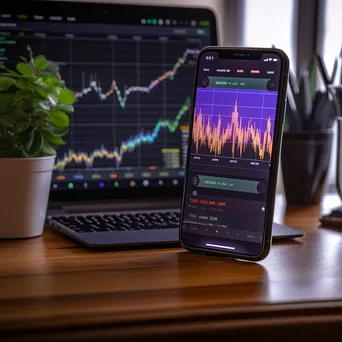 Smartphone showing stock market app with fluctuating graphs - Image 3
