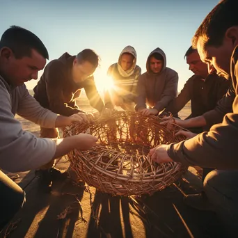 Artisans working on large baskets during sunset - Image 2