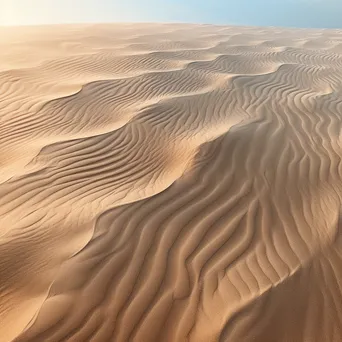 Close-up of soft beach sand with gentle curves. - Image 1