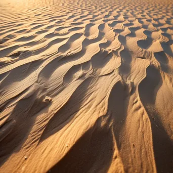 Close-up of soft beach sand with gentle curves. - Image 3