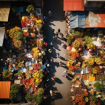 Overhead shot of a vibrant street market displaying fresh flowers and plants in various colors. - Image 4