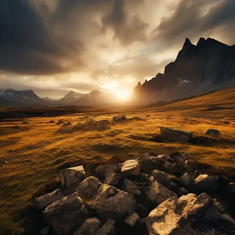 Rocky mountain plateau illuminated by sunrise and clouds. - Image 1