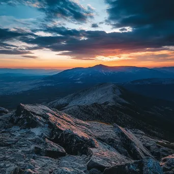 Rugged mountain plateau at sunset with contrasting shadows. - Image 3