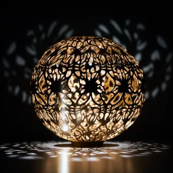 Intricate light sculpture with patterns of light and shadow in dark room - Image 1