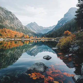 Alpine lake with autumn foliage reflecting in the water - Image 2