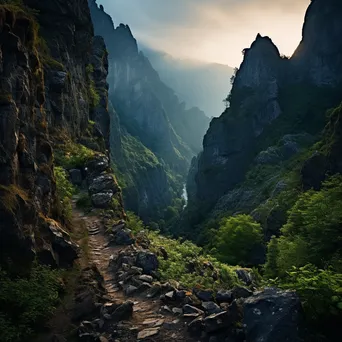 Rocky hillside path with cliffs and valley view at dawn - Image 2