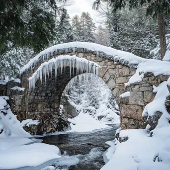 Stone bridge with snow and icicles in winter - Image 1