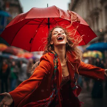 Woman dancing in the rain with a colorful umbrella - Image 1