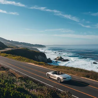 Luxury convertible on a coastal highway - Image 1