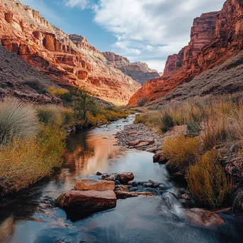 Meandering mountain stream flowing through colorful canyon with red rock layers. - Image 3