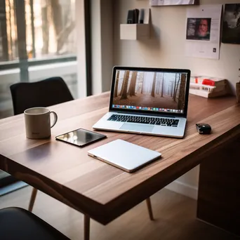 Minimalist office with laptop, coffee, and notepad on desk - Image 3