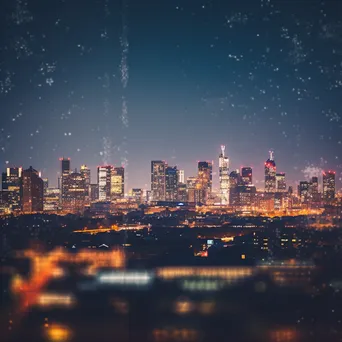 Blurred background of a city skyline at dusk with glowing lights - Image 2