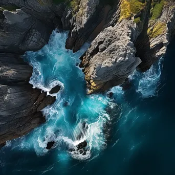 Aerial view of coastal caves and ocean - Image 4