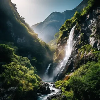 High-altitude waterfall flowing down rocky cliffs amid lush vegetation - Image 1